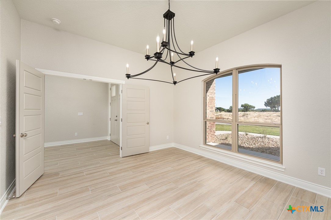 4249 Cold Springs Road Kempner, TX 76539 - Photo 7 of 48 a view of empty room with wooden floor and fan