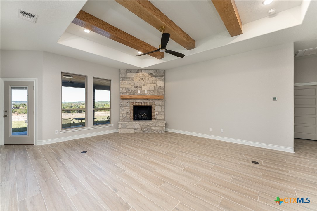 4249 Cold Springs Road Kempner, TX 76539 - Photo 8 of 48 a view of empty room with wooden floor and fan