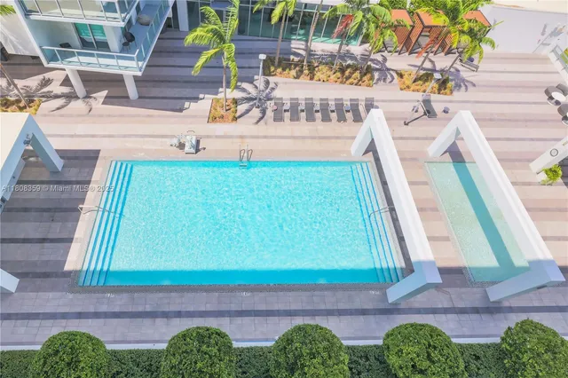 a view of a two chairs in the balcony