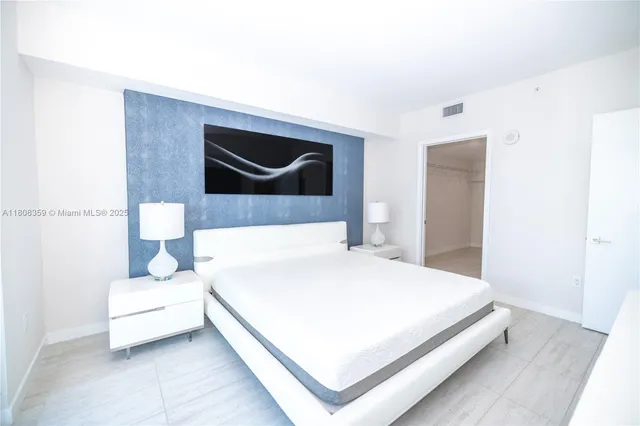 a bathroom with a bathtub and a lamp