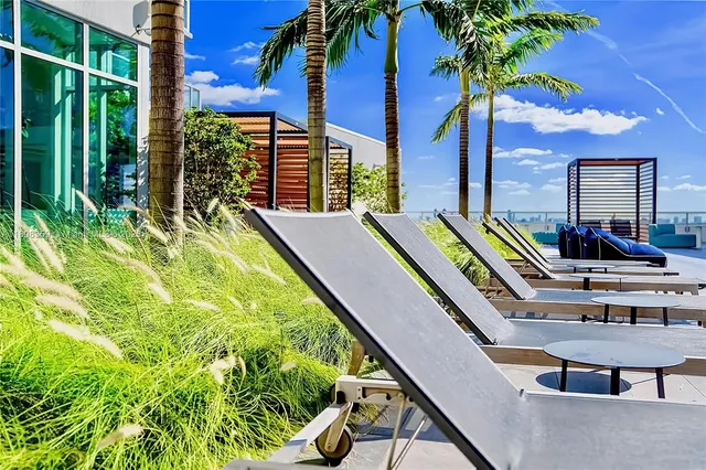 a house with swimming pool in front of it