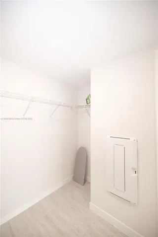 a bathroom with a toilet a sink and a mirror