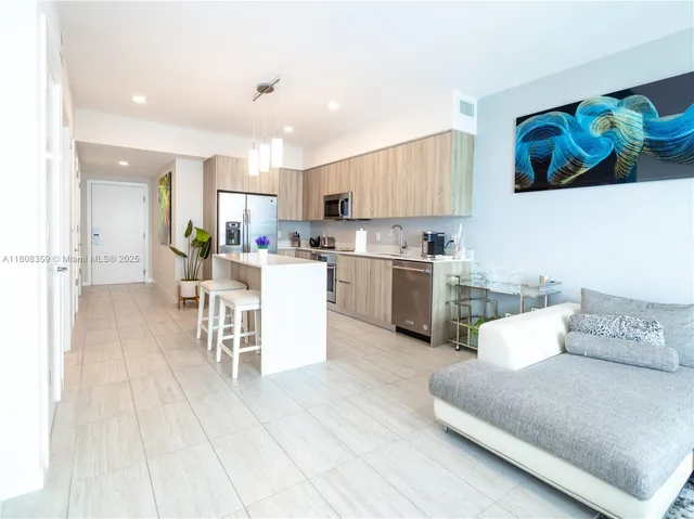 a kitchen with a sink cabinets and stainless steel appliances