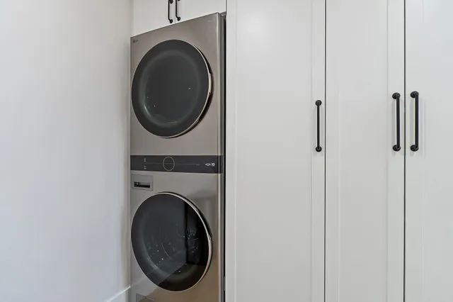 a view of a room with a table and chairs