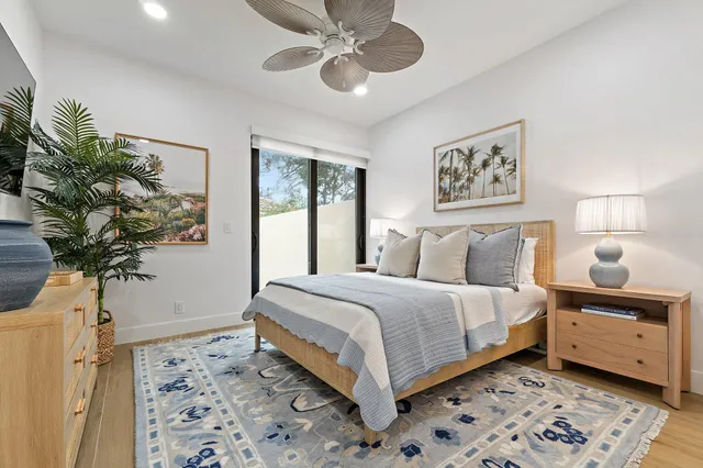 a bedroom with a bed and flat screen tv