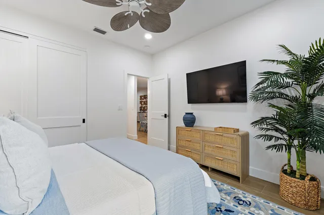 a bedroom with a bed and cabinet