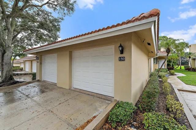 a large bedroom with a bed and lamp with the dresser