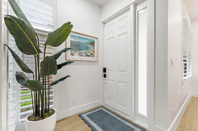 a view of entryway with wooden floor