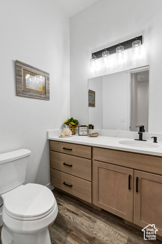 1952 Highway 118 Monroe, UT 84754 - Photo 35 of 88 Half bath with vanity and wood finished floors
