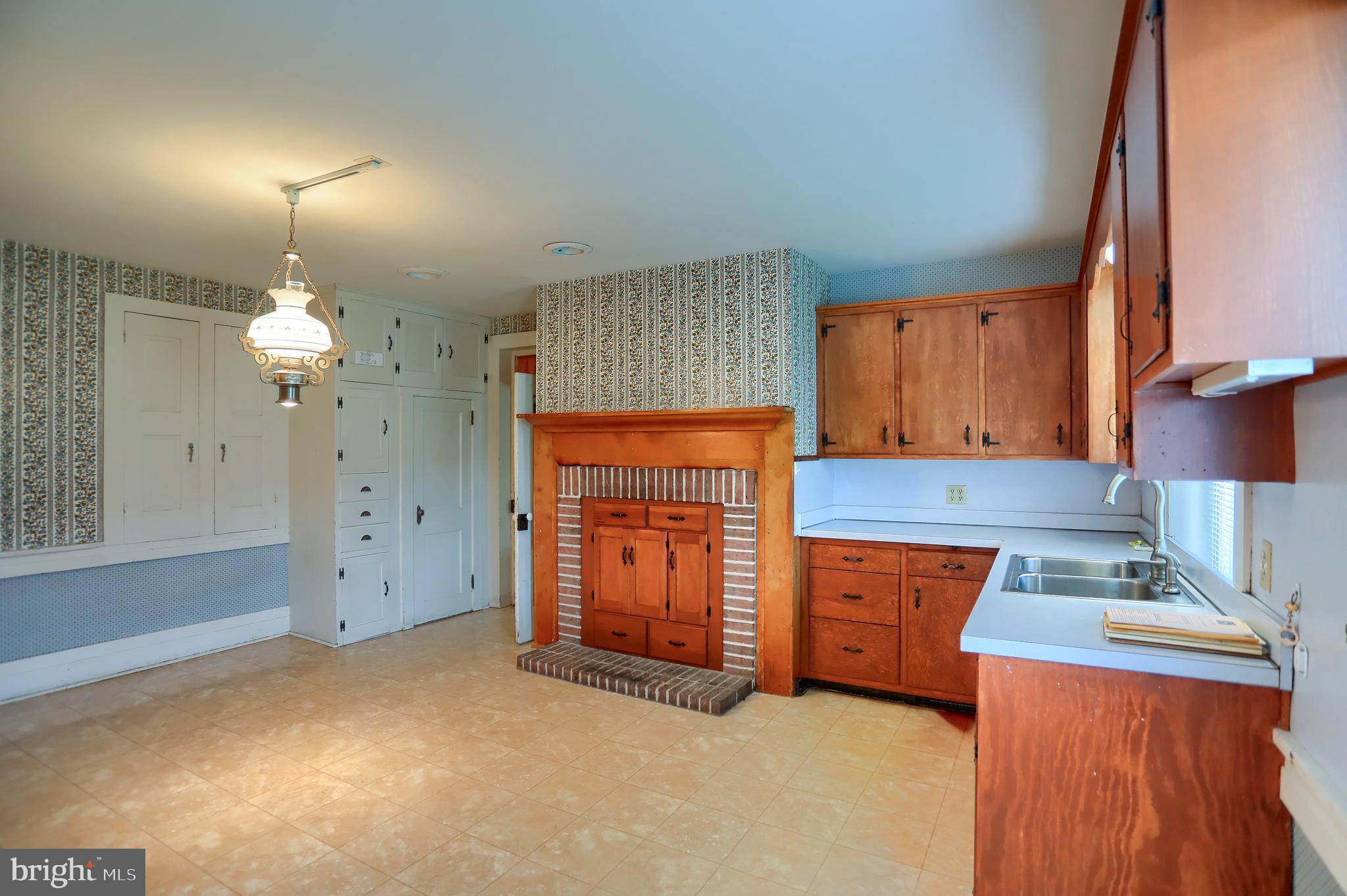 118 Bunker Hill Road Belleville, PA 17004 - Photo 18 of 90 a kitchen with stainless steel appliances granite countertop a refrigerator a sink dishwasher and wooden cabinets