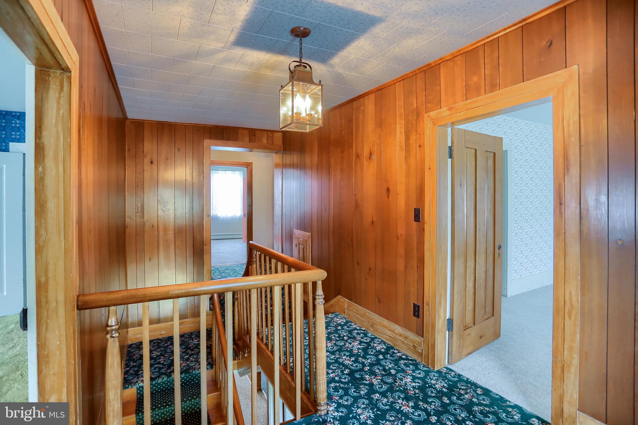 118 Bunker Hill Road Belleville, PA 17004 - Photo 24 of 90 a view of a hallway with wooden floor and staircase