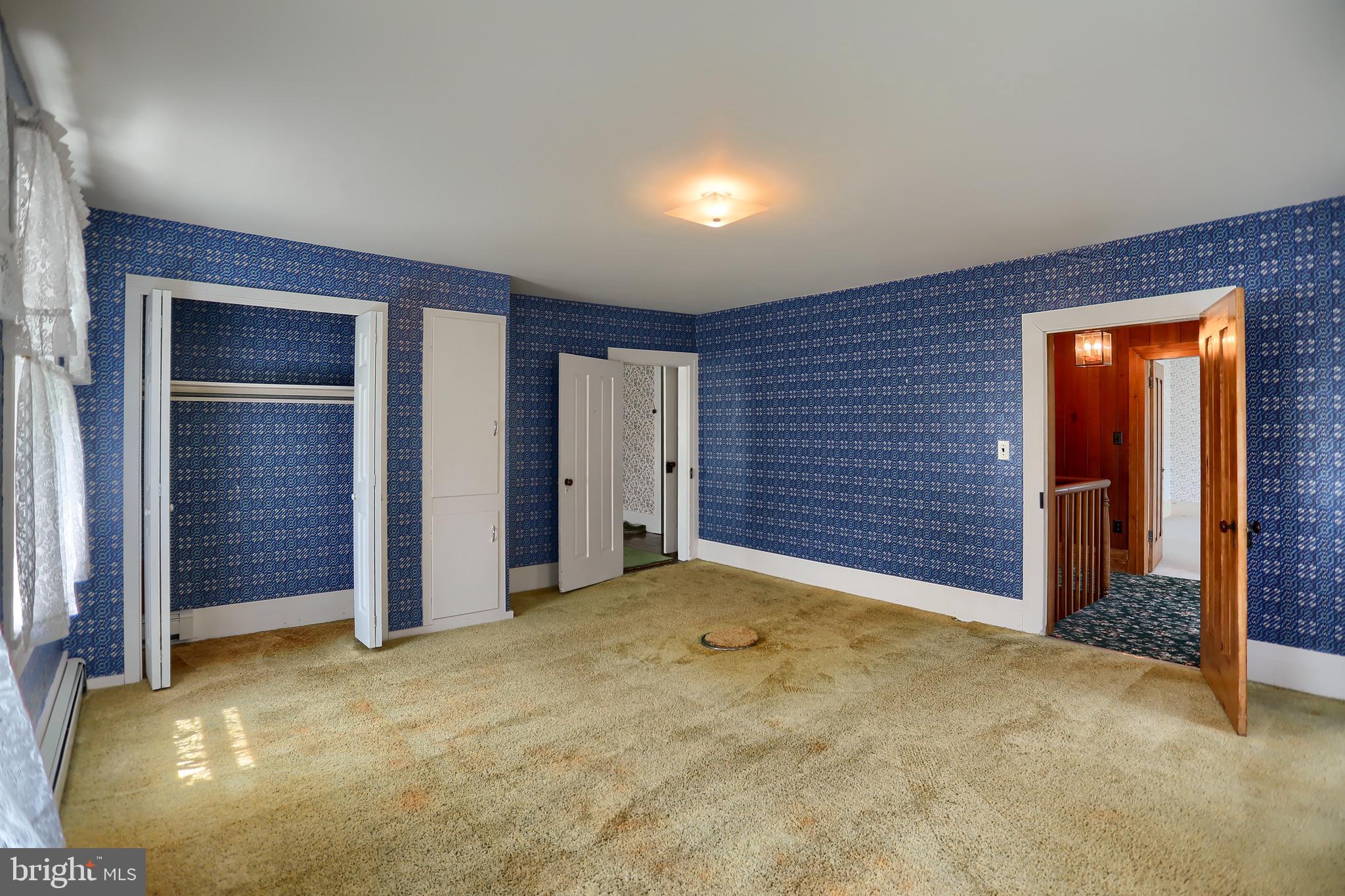 118 Bunker Hill Road Belleville, PA 17004 - Photo 25 of 90 an empty room with closet and sliding door