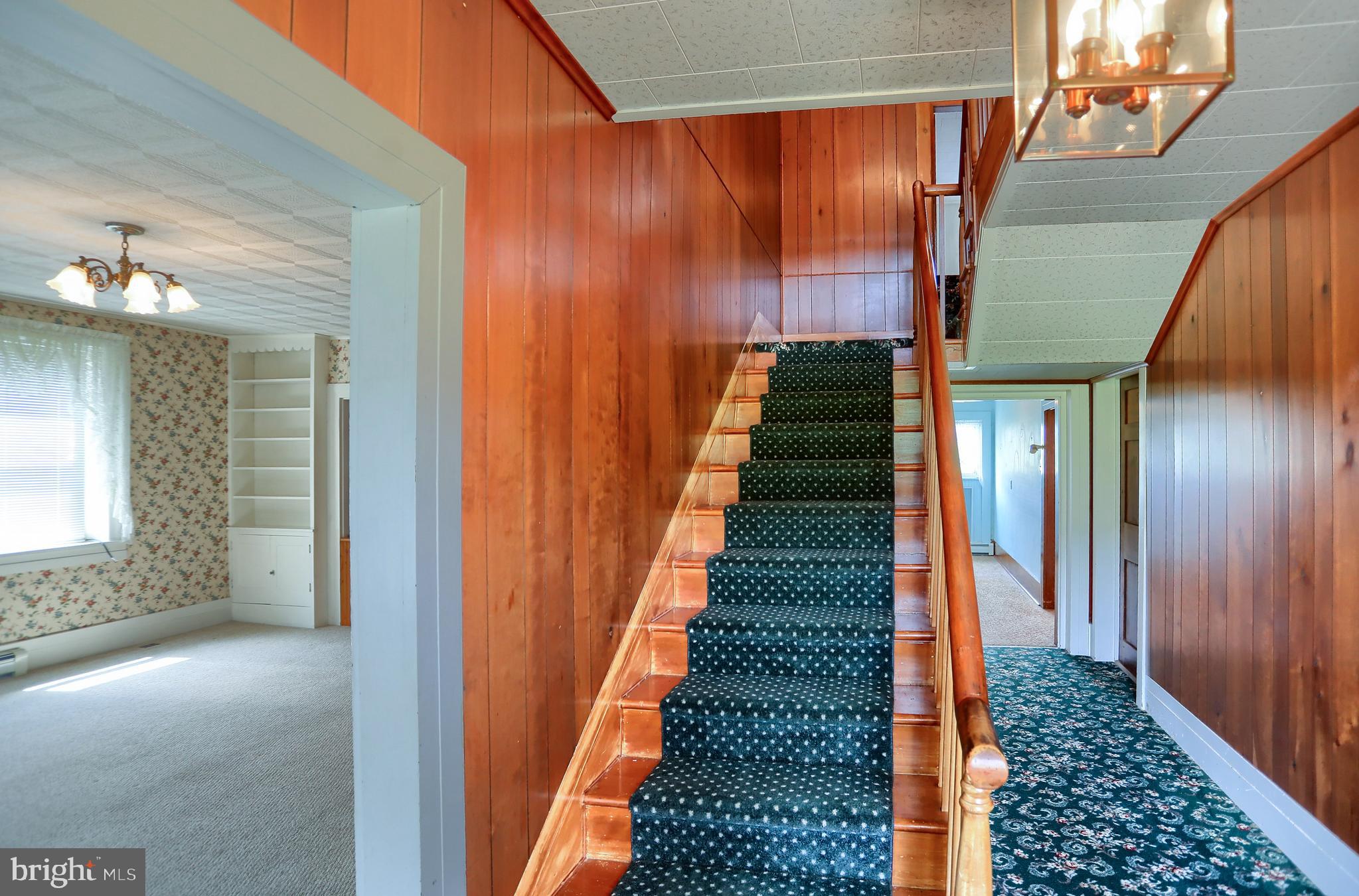 118 Bunker Hill Road Belleville, PA 17004 - Photo 6 of 90 a view of a hallway with wooden floor and staircase