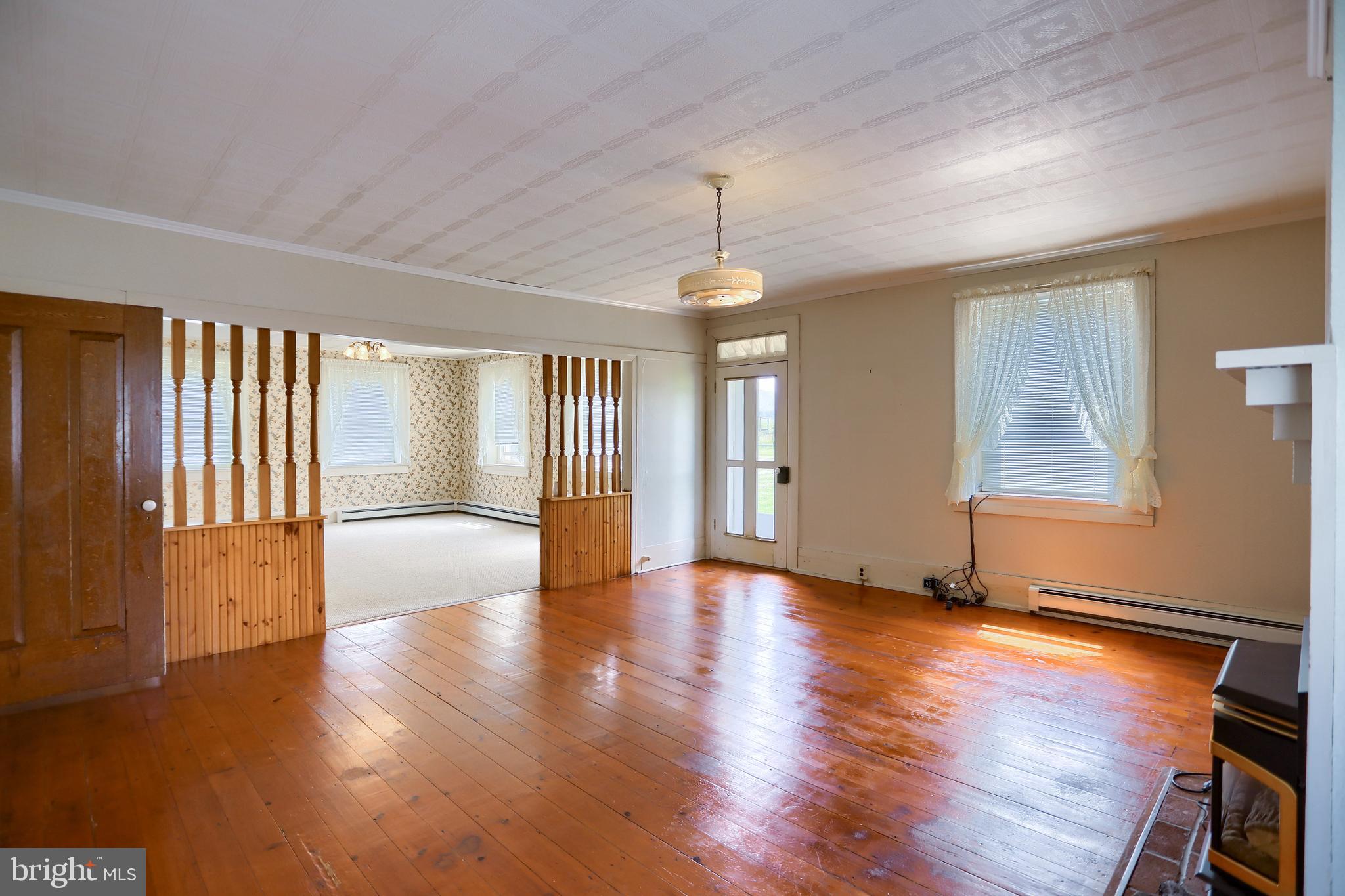 118 Bunker Hill Road Belleville, PA 17004 - Photo 10 of 90 a view of an empty room with wooden floor and a window