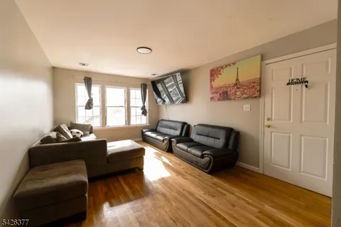 a kitchen with stainless steel appliances granite countertop a refrigerator a sink and a stove