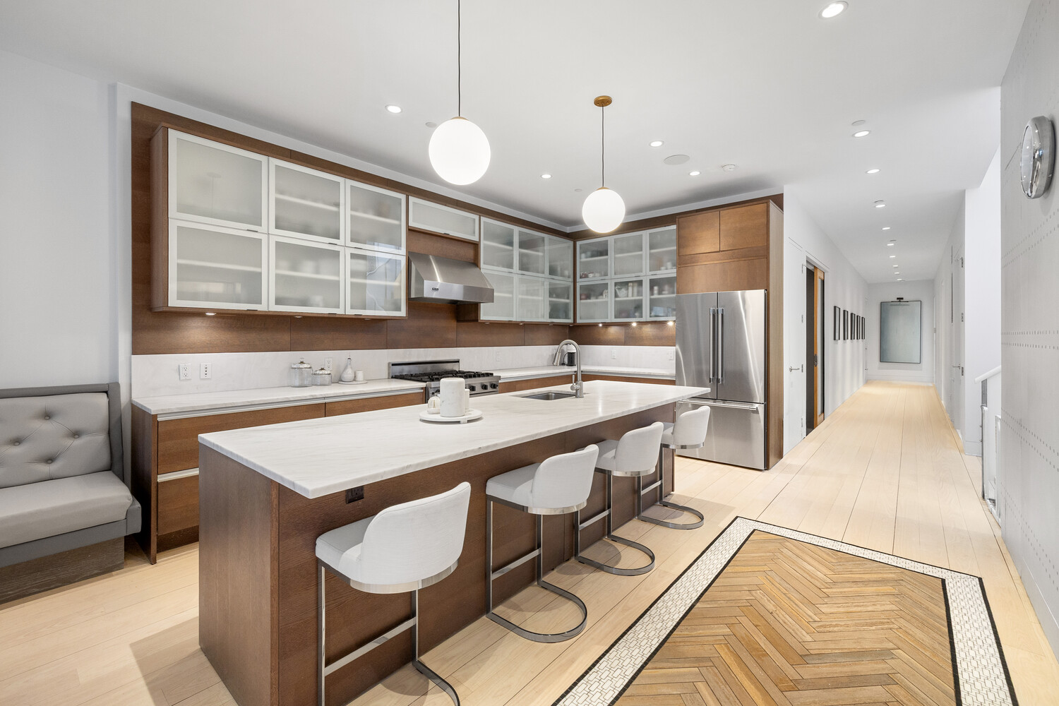85 Leonard Street, Unit PH Manhattan, NY 10013 - Photo 4 of 21 a large kitchen with a table and chairs