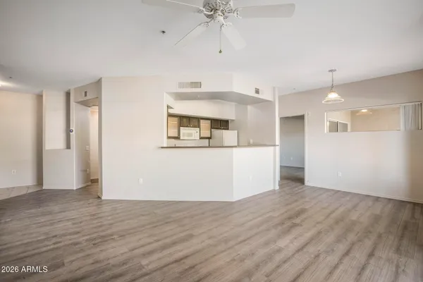 a view of a kitchen cabinets and wooden floor