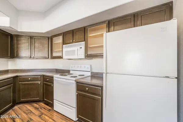 a kitchen with a sink a stove and refrigerator