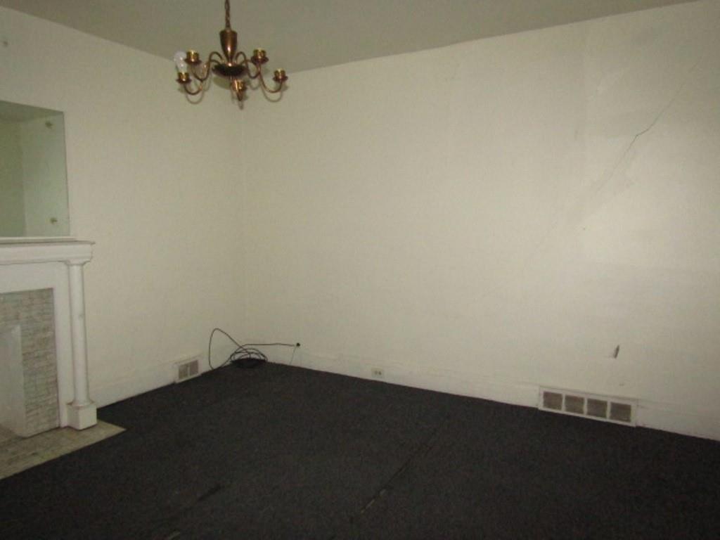 2348 McCook Street Pittsburgh, PA 15212 - Photo 6 of 27 an empty room with a fireplace