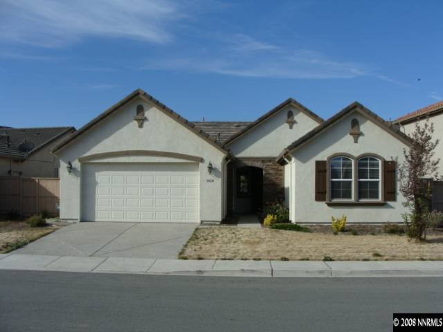 10628 Fire Poppy Circle Reno, NV 89521 - Photo 1 of 1 a front view of a house with a yard