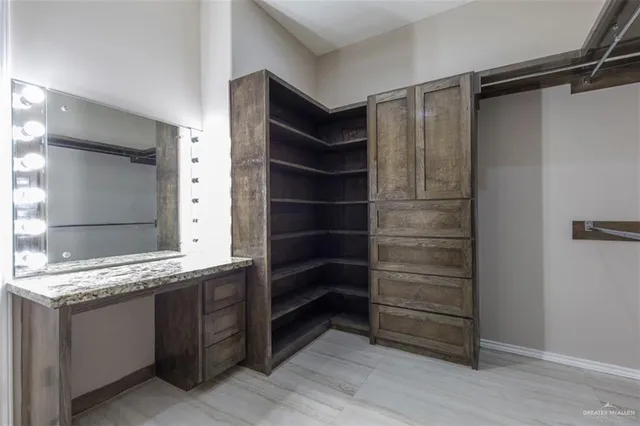 a bathroom with a shower and a sink