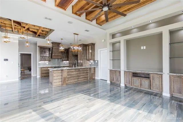 a view of kitchen with cabinets and wooden floor