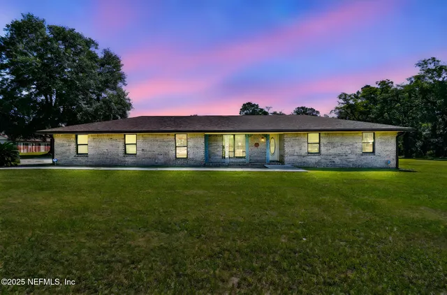a view of an ocean and a yard