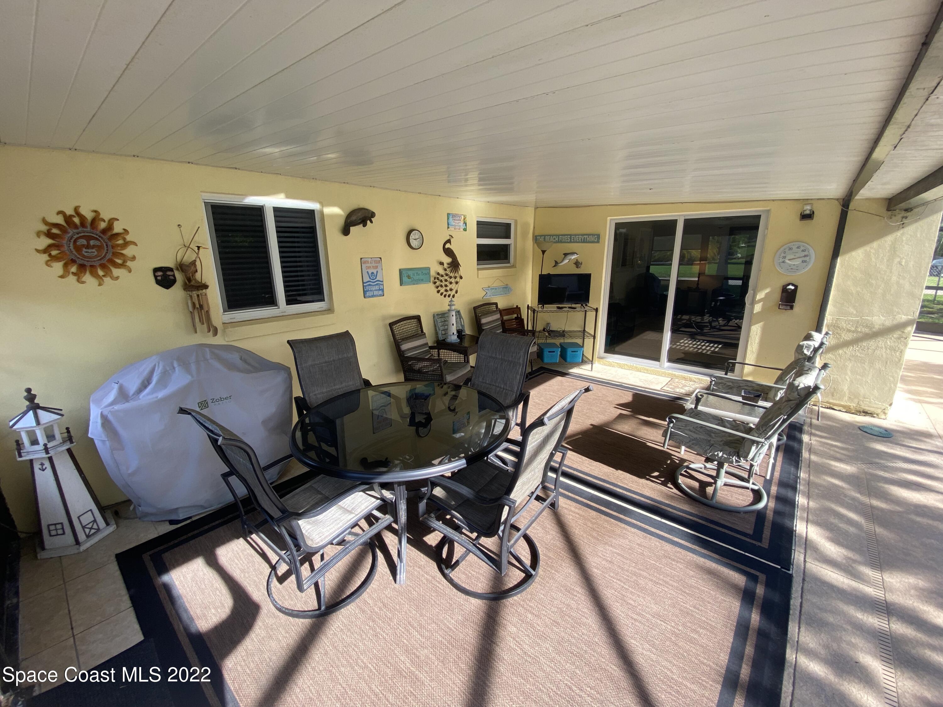 8800 Sea Shell Lane Cape Canaveral, FL 32920 - Photo 16 of 22 a living room with furniture