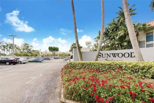 a sign board with a street sign on the side of it