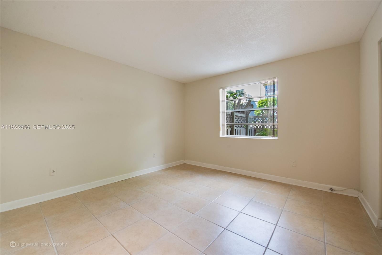 4600 Southwest 67th Avenue, Unit 125 Miami, FL 33155 - Photo 8 of 11 an empty room with windows
