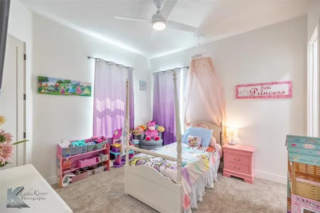a bedroom with furniture and a chandelier