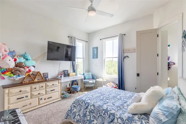 a bedroom with furniture a bed and a dresser