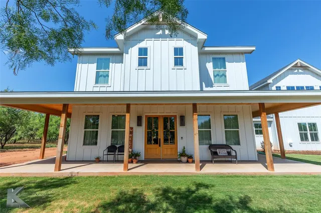 front view of a house with a yard