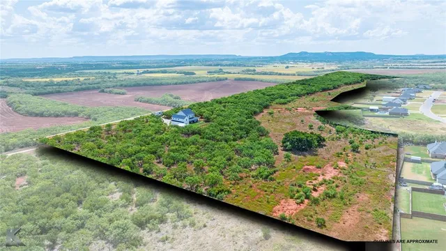 a view of a lake with a big yard