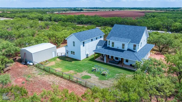 an aerial view of a house with a garden