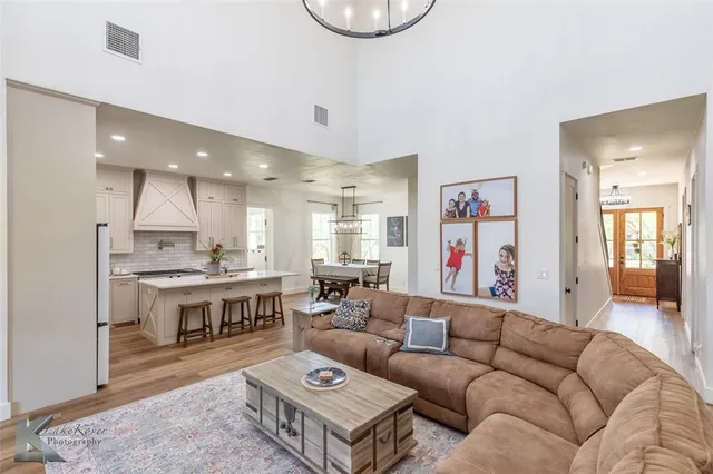 a living room with furniture kitchen and a kitchen view