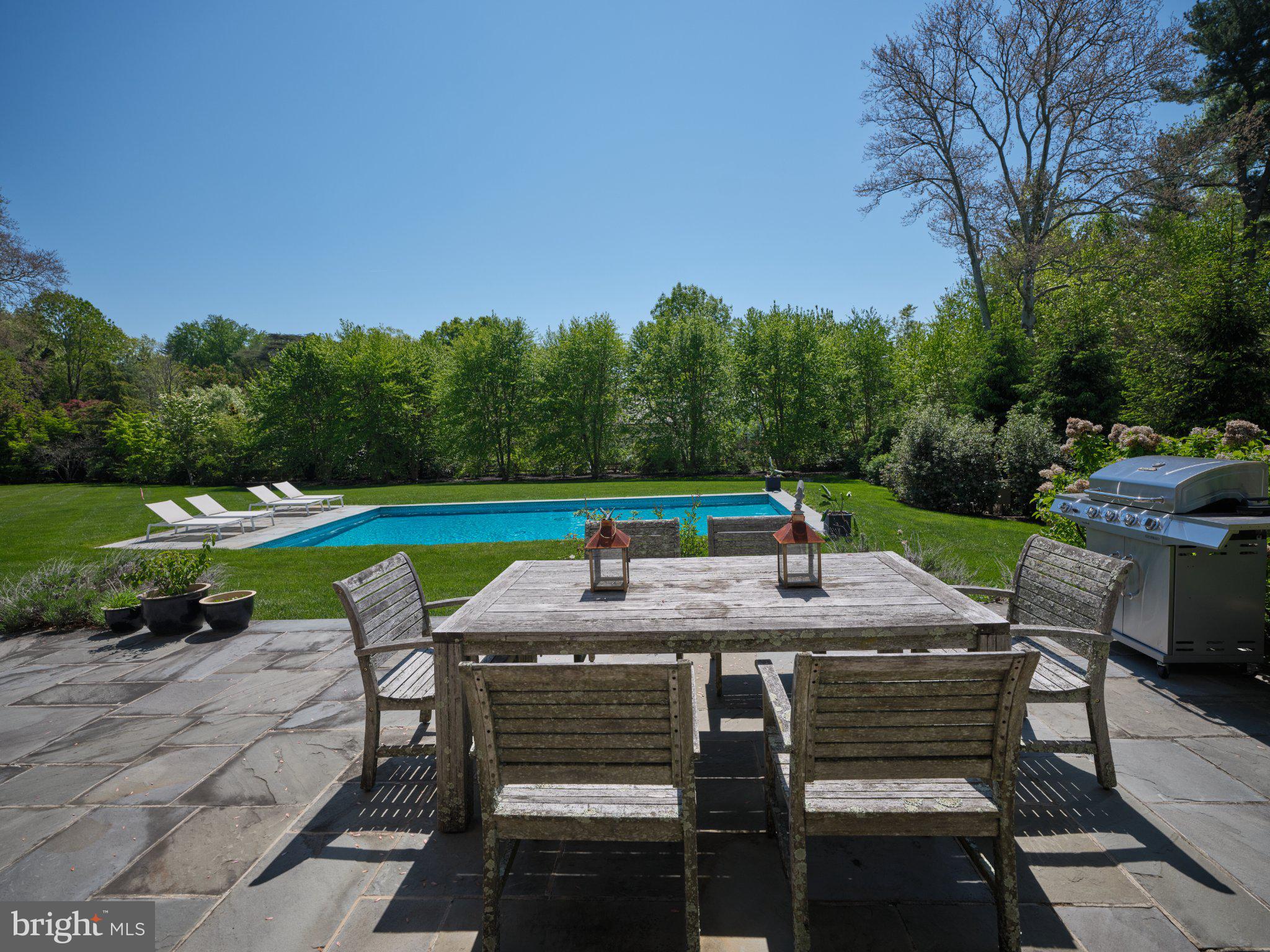 617 Harriton Road Bryn Mawr, PA 19010 - Photo 3 of 34 Sunny patio with poolside serenity.