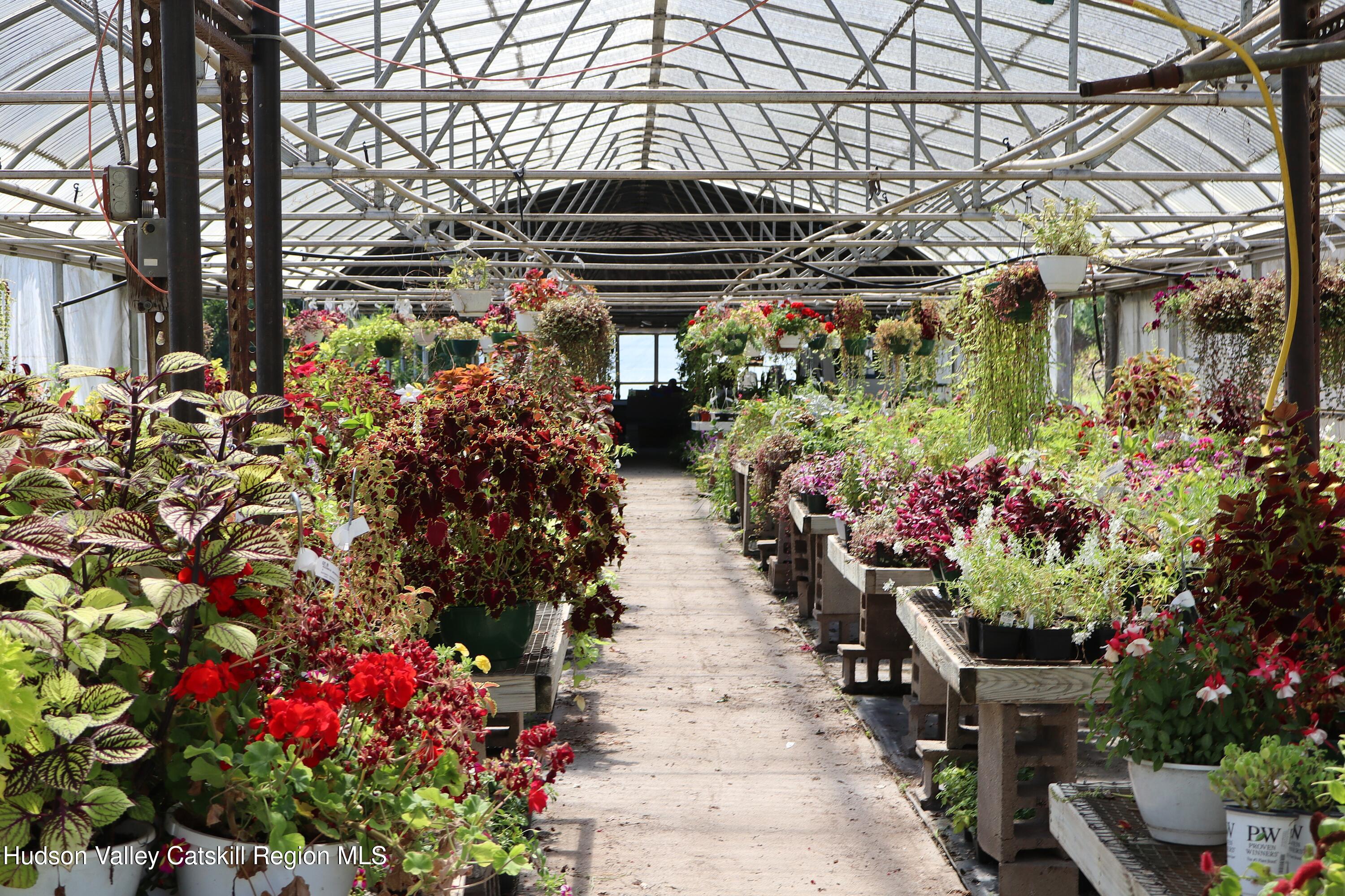 2050 Sawkill Ruby Road Kingston, NY 12401 - Photo 1 of 38 a front view of a multi story building with yard