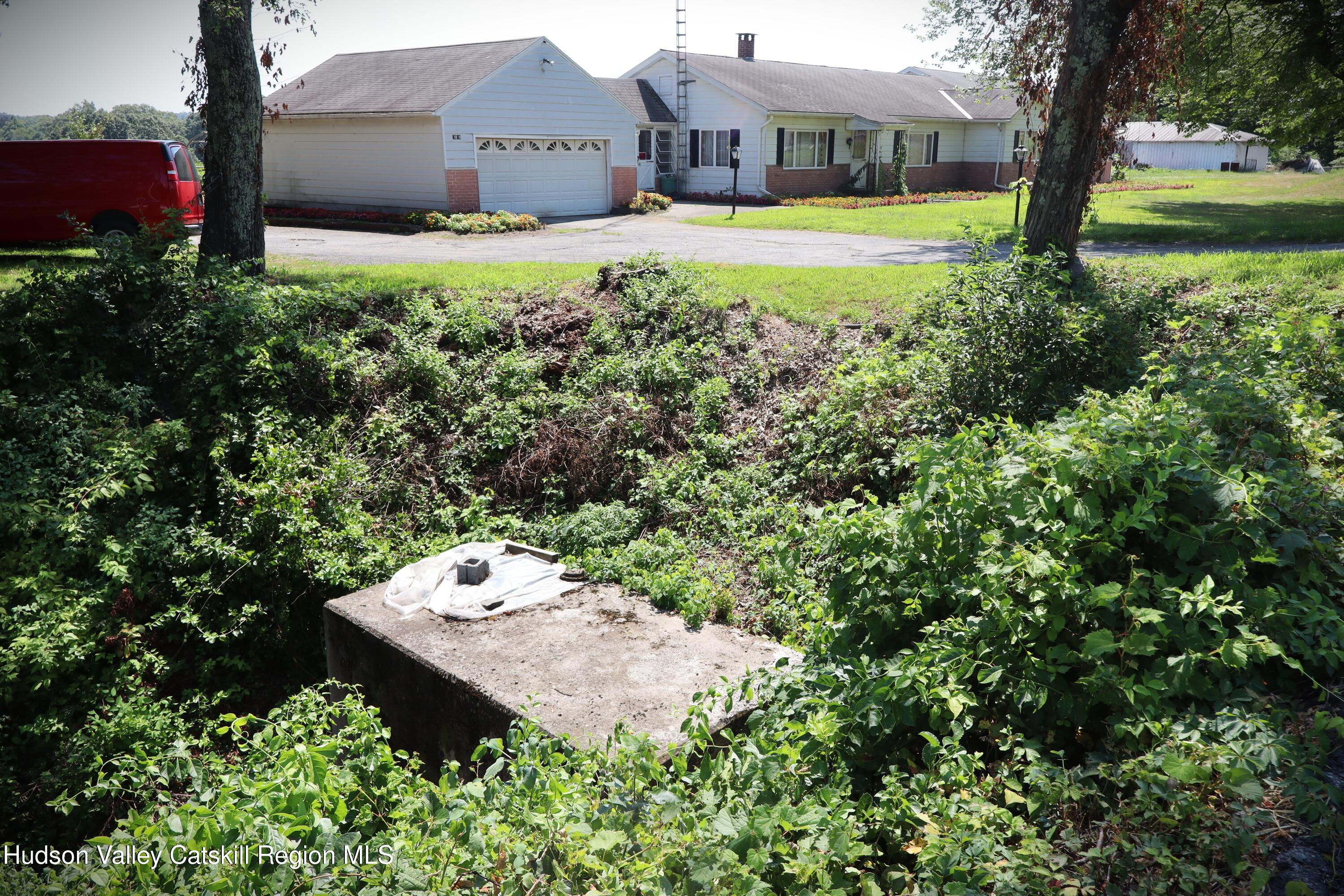 2050 Sawkill Ruby Road Kingston, NY 12401 - Photo 18 of 38 a view of a house with a yard and large trees