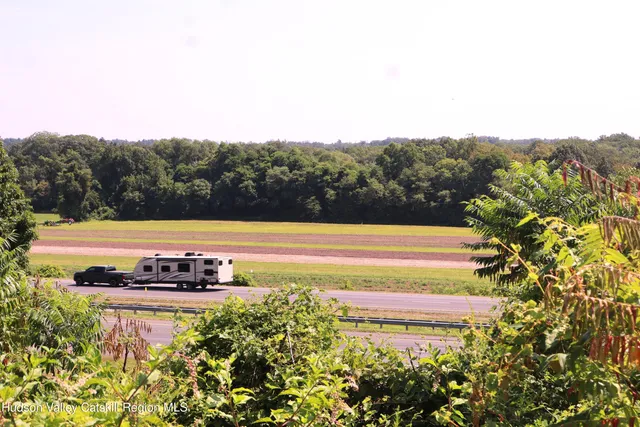 a view of a swimming pool with a yard