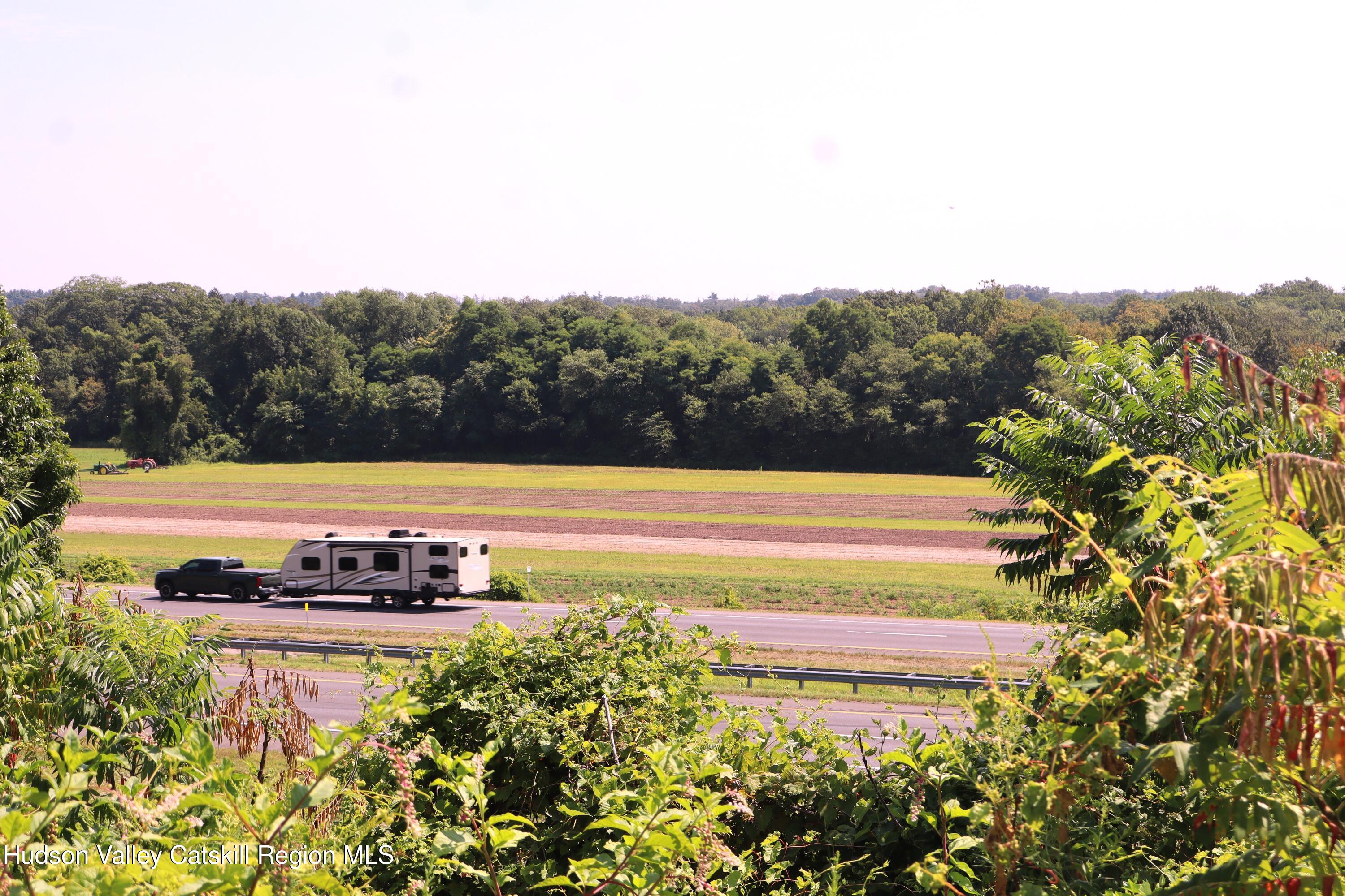2050 Sawkill Ruby Road Kingston, NY 12401 - Photo 19 of 38 a view of a swimming pool with a yard