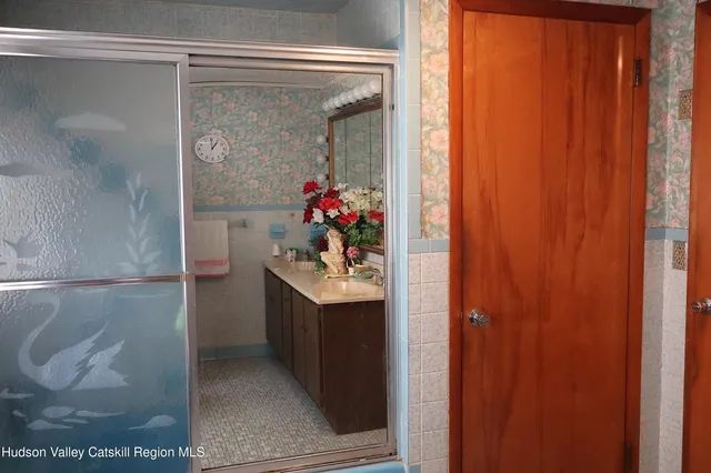 a bathroom with a sink and mirror