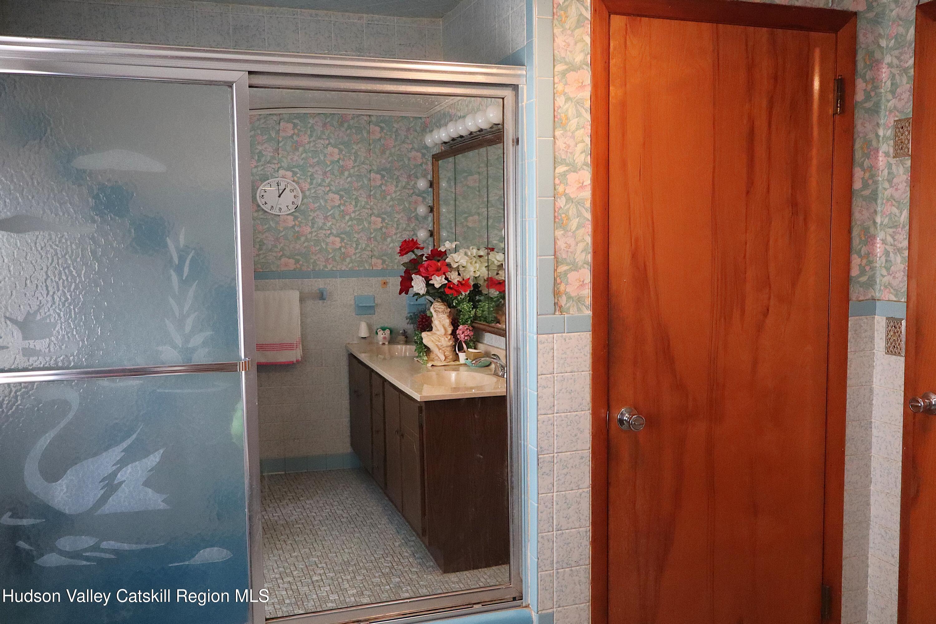 2050 Sawkill Ruby Road Kingston, NY 12401 - Photo 34 of 38 a bathroom with a sink and mirror