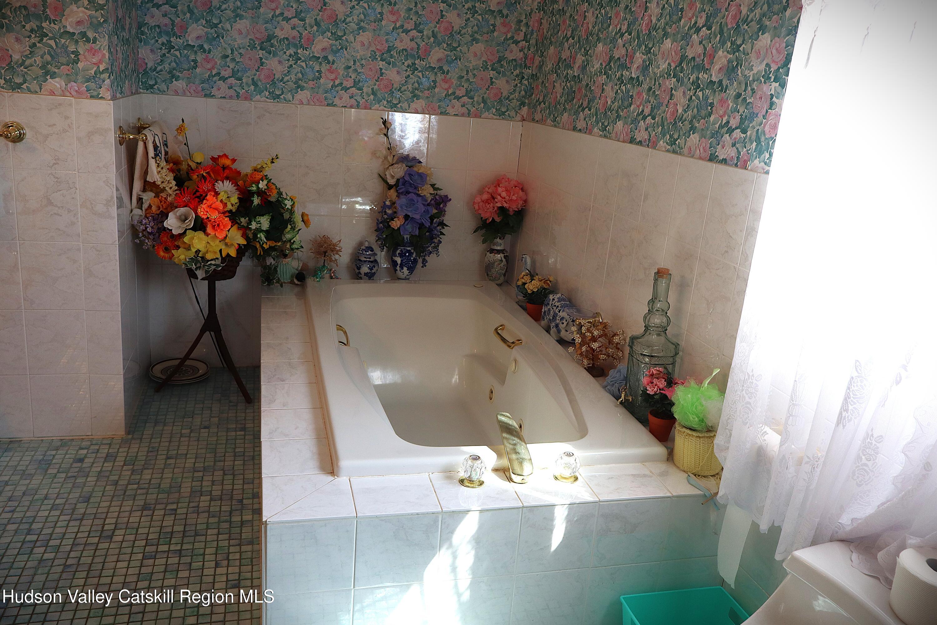 2050 Sawkill Ruby Road Kingston, NY 12401 - Photo 35 of 38 with a vase of flowers sitting on a table