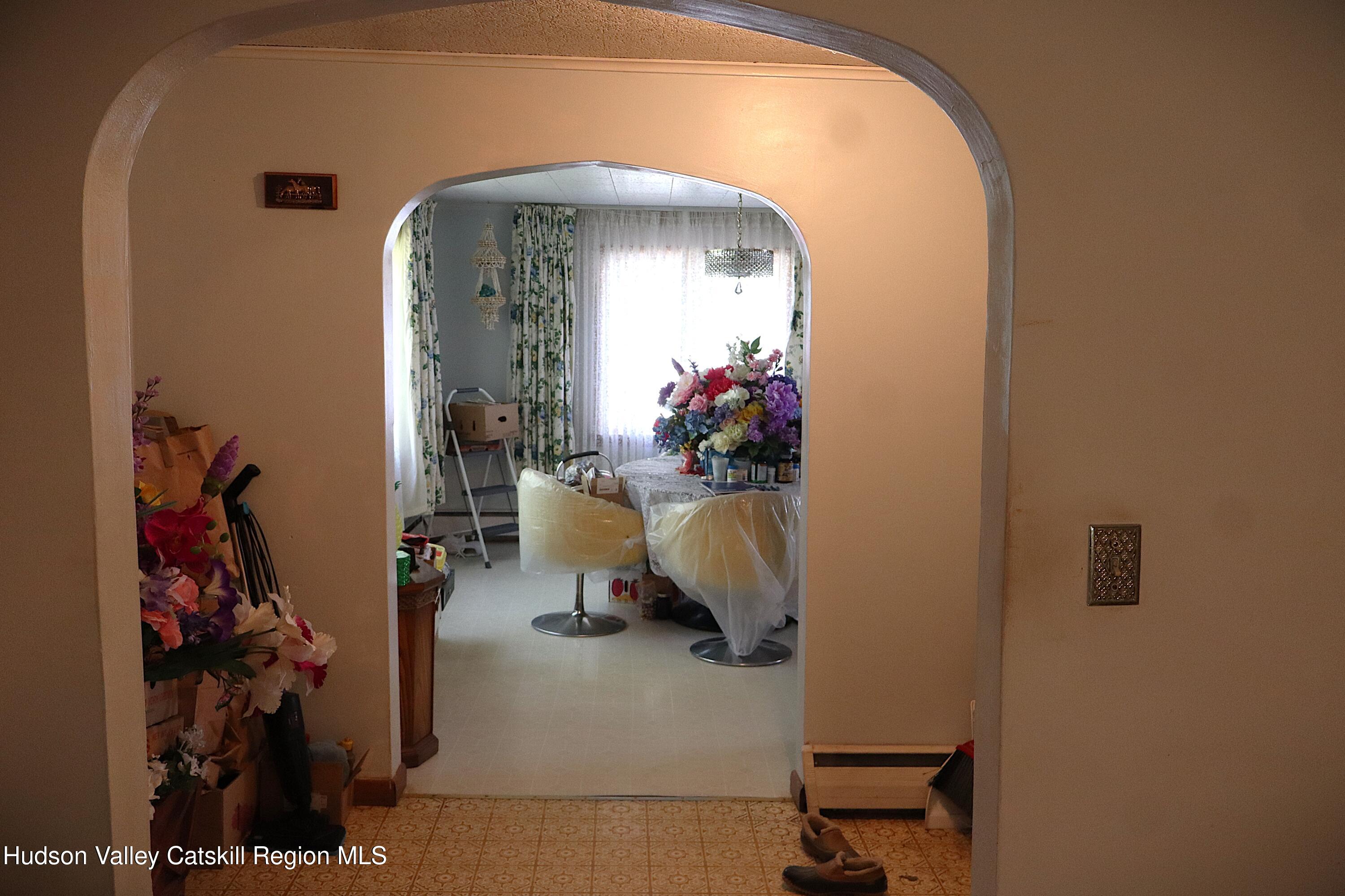 2050 Sawkill Ruby Road Kingston, NY 12401 - Photo 36 of 38 a living room with furniture and a potted plant
