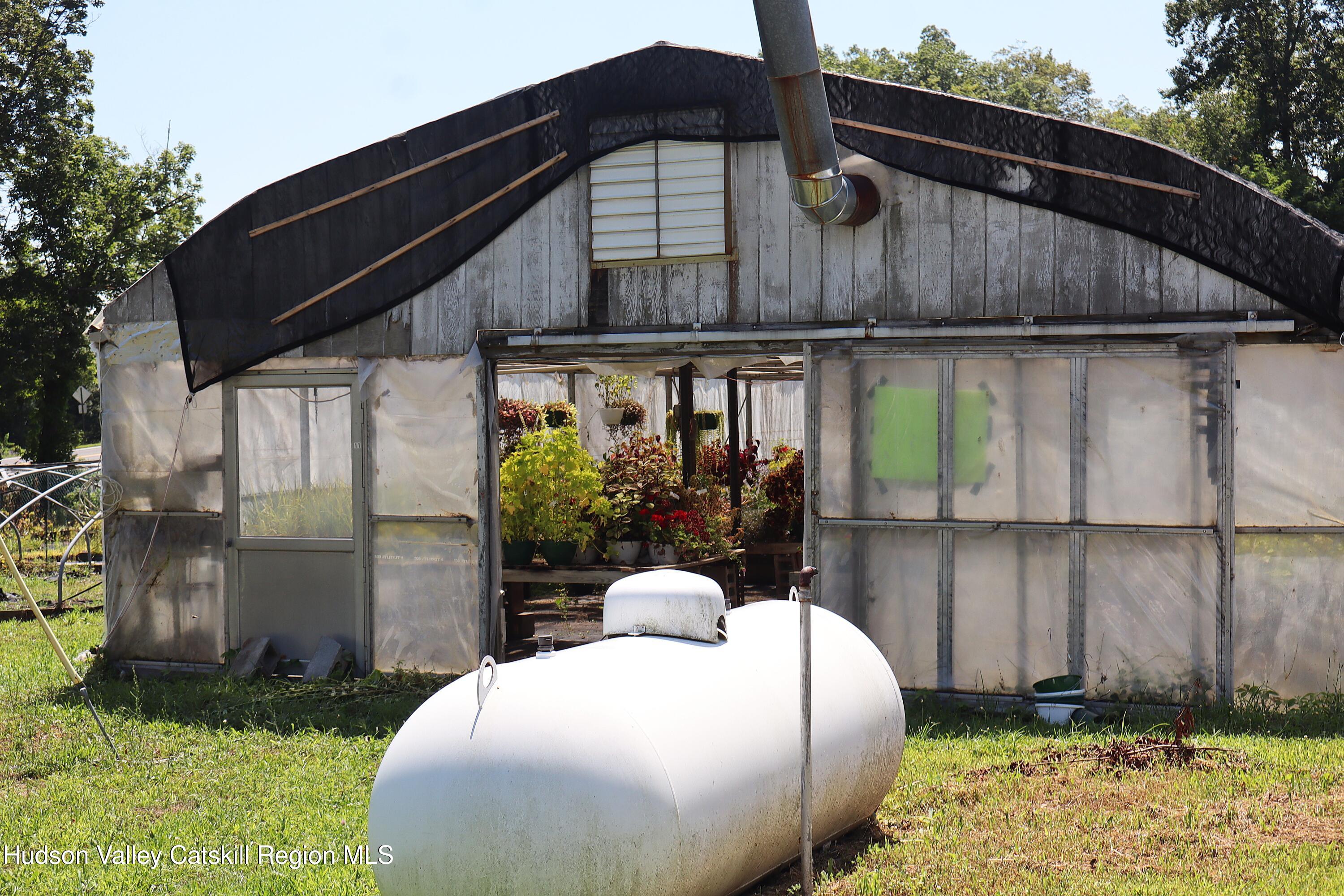 2050 Sawkill Ruby Road Kingston, NY 12401 - Photo 7 of 38 a front view of a house with garden