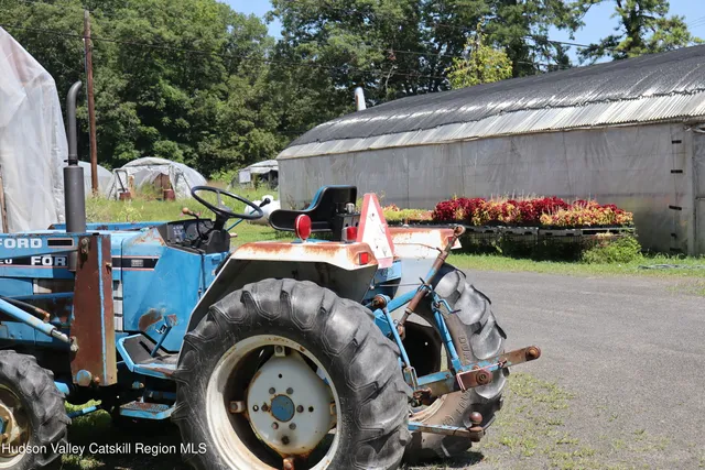 a view of a patio with table and chairs potted plants