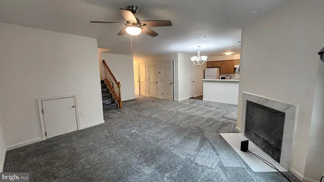 a view of entryway and kitchen