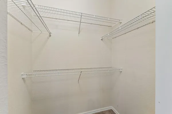 a view of a room with racks on the wall