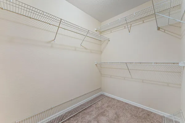 a view of a room with racks on the wall